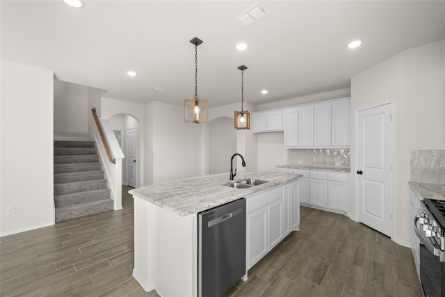 7701 Oakmeade St, Joshua, TX 76058 - kitchen with appliances with stainless steel finishes, a sink, wood finished floors, arched walkways, and white cabinetry