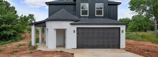 view of front of property with a garage