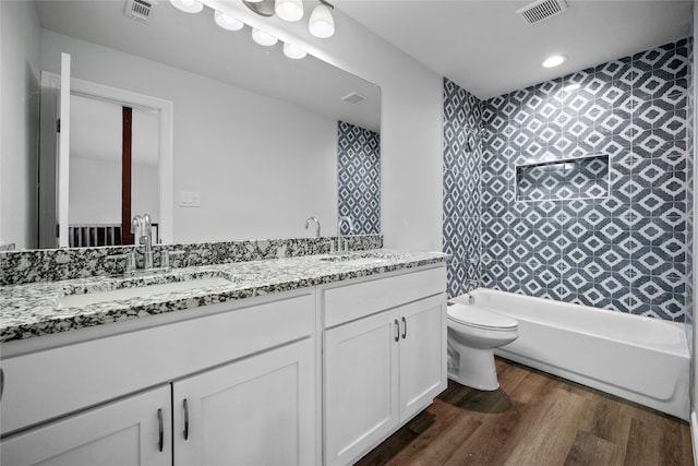 full bathroom featuring wood-type flooring, vanity, toilet, and shower / bath combination