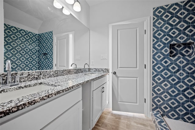 bathroom with vanity and hardwood / wood-style flooring