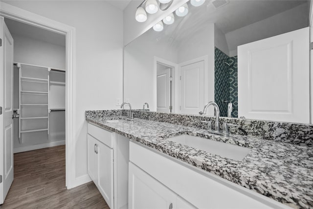 bathroom featuring vanity and hardwood / wood-style floors