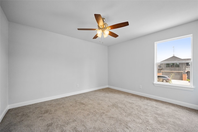 empty room with carpet flooring and ceiling fan