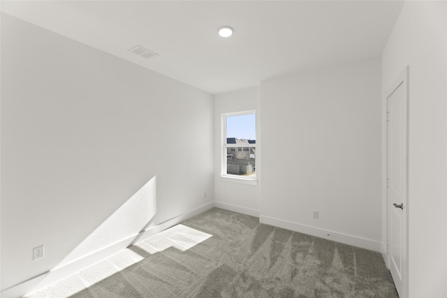 unfurnished room with carpet floors