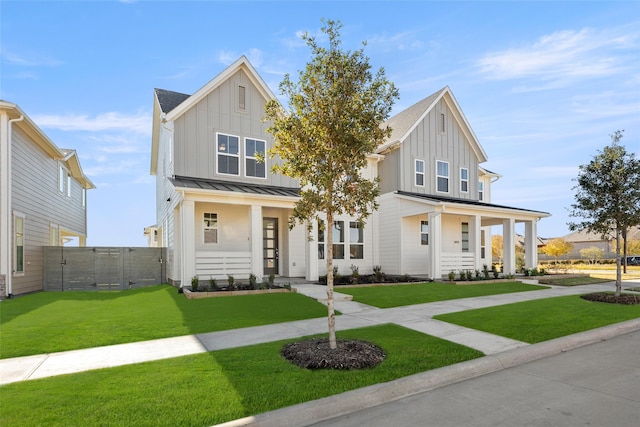 view of front of house with a porch and a front lawn