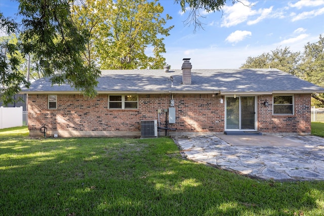 back of house with a lawn, a patio area, and central air condition unit