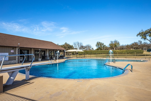 view of swimming pool featuring a patio area