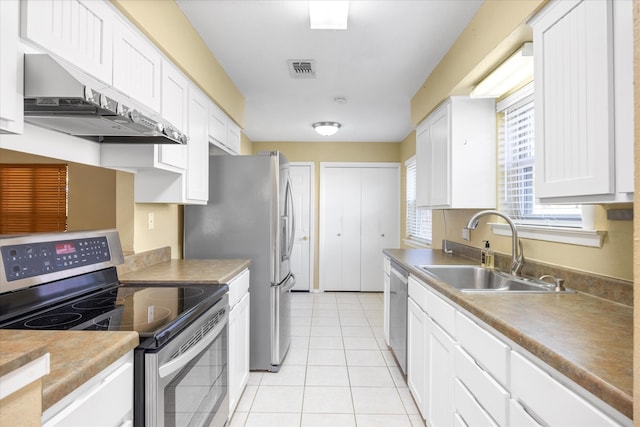 kitchen featuring sink, ventilation hood, white cabinets, appliances with stainless steel finishes, and light tile patterned floors