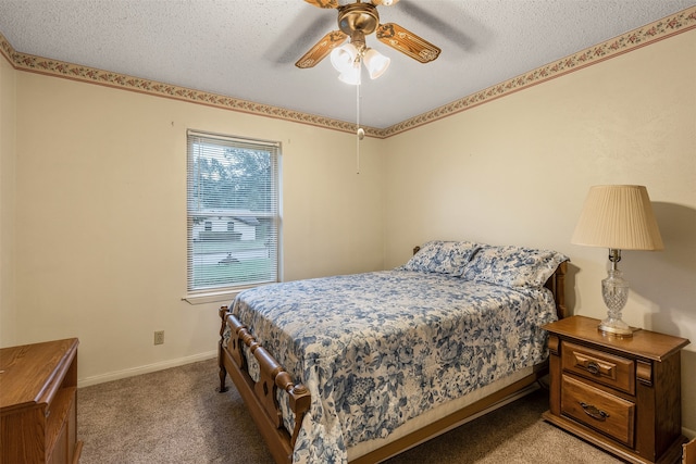 bedroom featuring a textured ceiling, carpet flooring, and ceiling fan