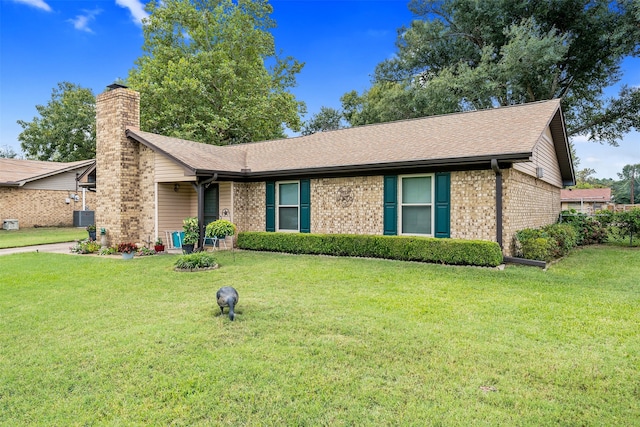 single story home with a front lawn