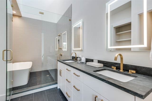 bathroom featuring plus walk in shower, tile patterned flooring, and vanity