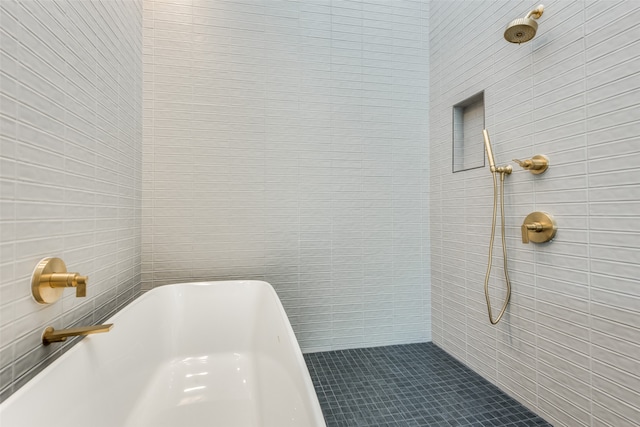 bathroom featuring separate shower and tub and tile walls