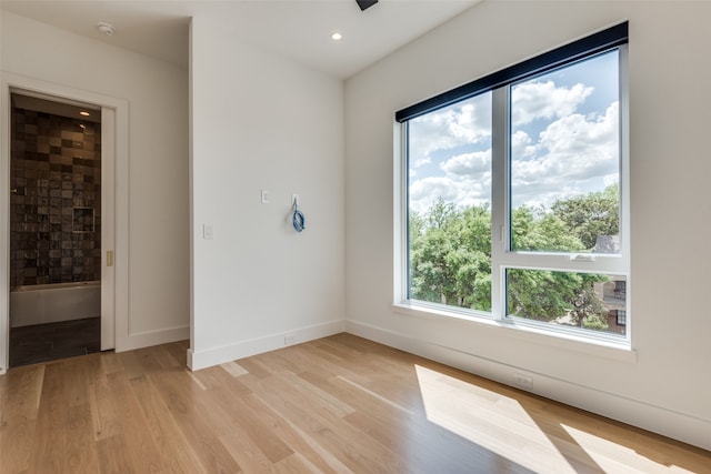 spare room featuring light hardwood / wood-style floors