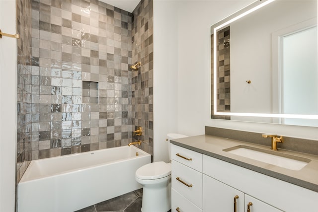 full bathroom with tile patterned flooring, vanity, toilet, and tiled shower / bath