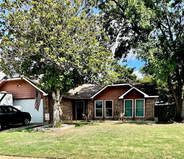 single story home featuring a front yard and a garage