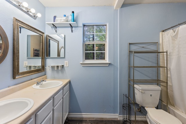 full bathroom featuring shower / bath combo with shower curtain, vanity, hardwood / wood-style floors, and toilet