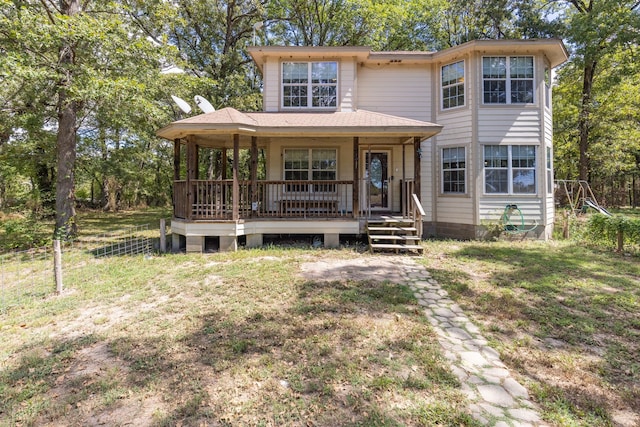 view of front facade with a porch and a front lawn