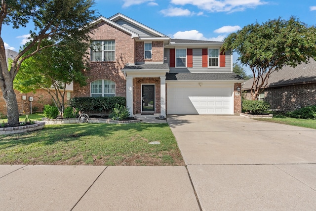 view of front of house with a front yard and a garage