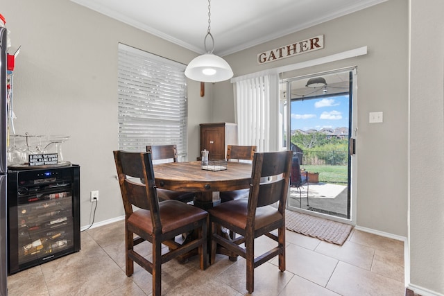 tiled dining space featuring ornamental molding