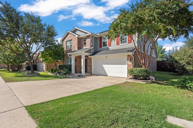 view of front of home with a garage and a front lawn