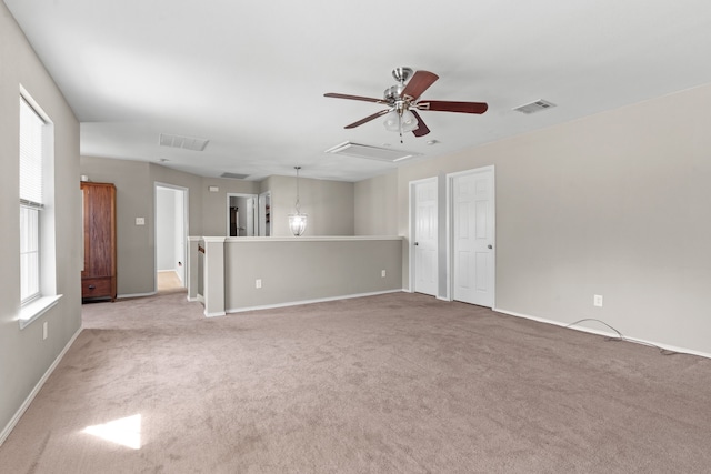 unfurnished living room with ceiling fan and light colored carpet