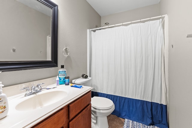 full bathroom featuring shower / bath combination with curtain, vanity, and toilet