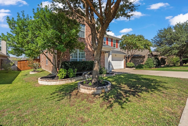 view of front of property with a front yard and a garage