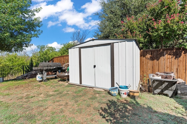 view of outbuilding with a yard