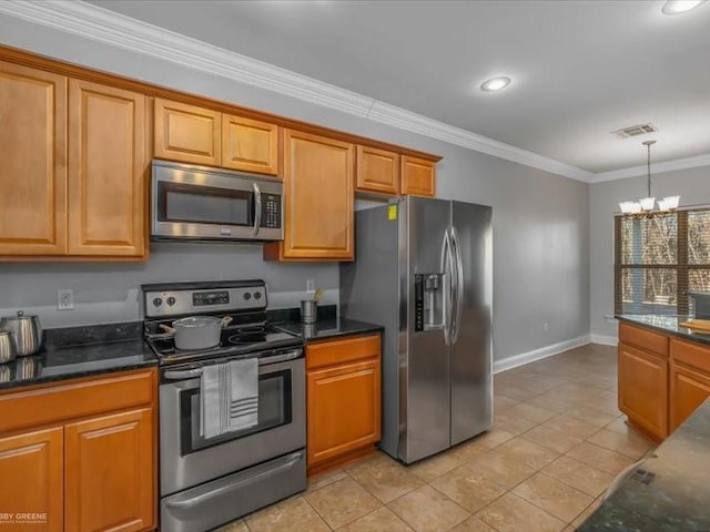 kitchen with appliances with stainless steel finishes, a notable chandelier, crown molding, and light tile patterned floors