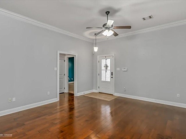 entrance foyer with ceiling fan, ornamental molding, and hardwood / wood-style floors