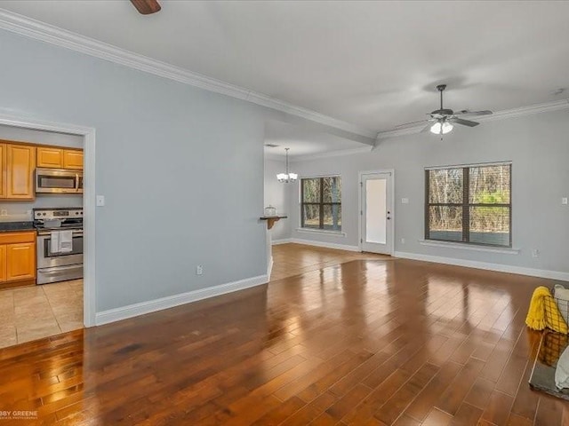 living room featuring ceiling fan with notable chandelier, ornamental molding, and light hardwood / wood-style floors