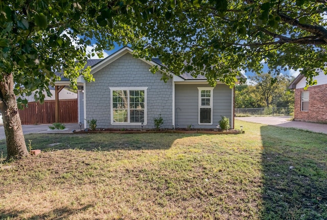 back of house featuring a patio and a yard