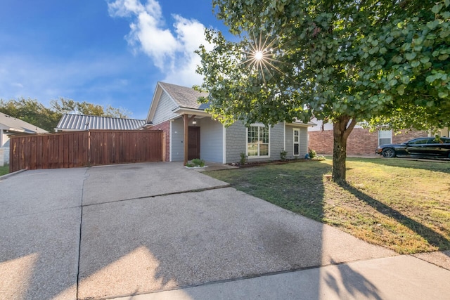 obstructed view of property with a garage and a front yard