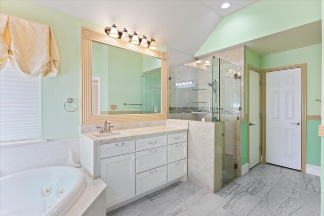 bathroom featuring lofted ceiling, vanity, and separate shower and tub