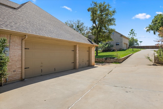 garage featuring a yard