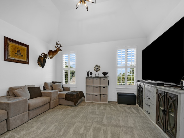 carpeted living room with vaulted ceiling