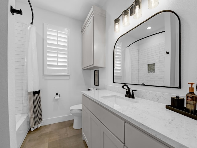 full bathroom featuring vanity, toilet, and shower / tub combo with curtain