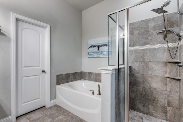 bathroom with independent shower and bath and tile patterned floors