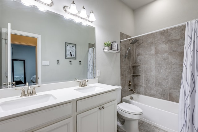 full bathroom featuring shower / bath combination with curtain, vanity, tile patterned flooring, and toilet