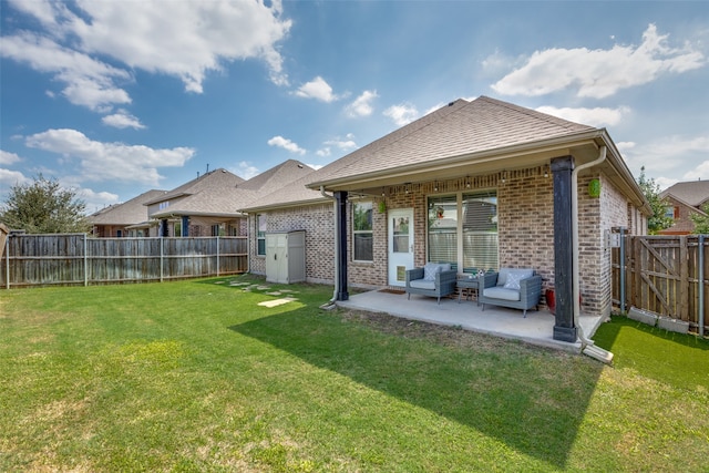 back of property featuring a yard and a patio area