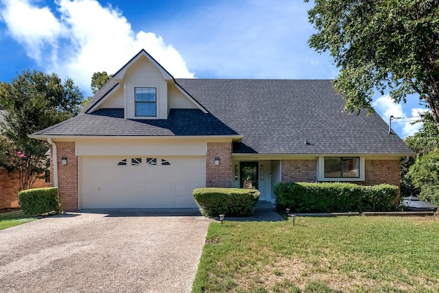 view of front facade with a front yard and a garage