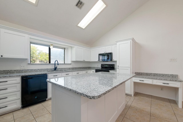 kitchen with black appliances, a center island, white cabinetry, and sink