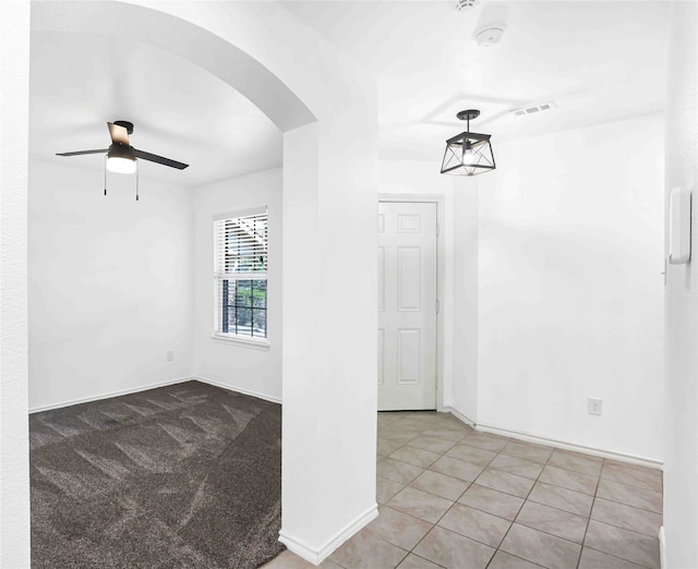 hallway featuring light tile patterned floors