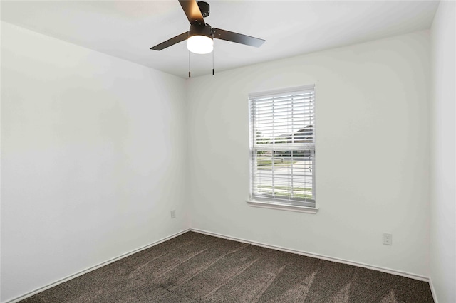 empty room featuring carpet flooring and ceiling fan