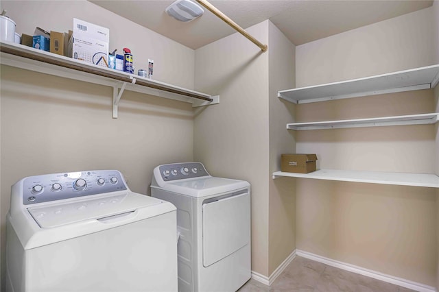 laundry room with washing machine and clothes dryer