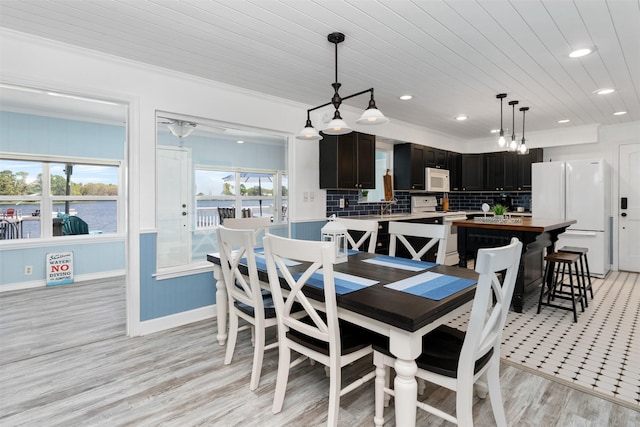 dining space featuring wooden ceiling, light wood-type flooring, recessed lighting, baseboards, and ornamental molding