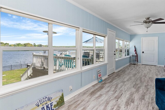 sunroom with a water view