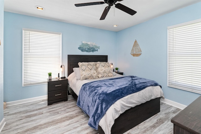 bedroom with baseboards, recessed lighting, a ceiling fan, and light wood finished floors