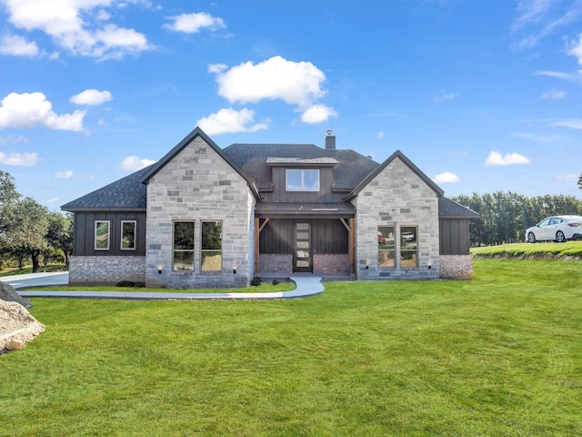 rear view of house with a yard