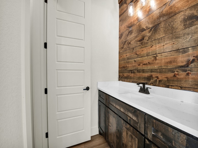 bathroom featuring vanity and hardwood / wood-style flooring