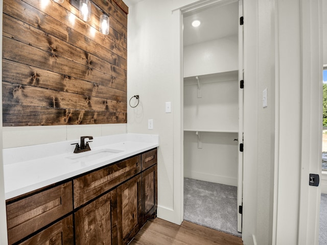 bathroom featuring hardwood / wood-style floors and vanity